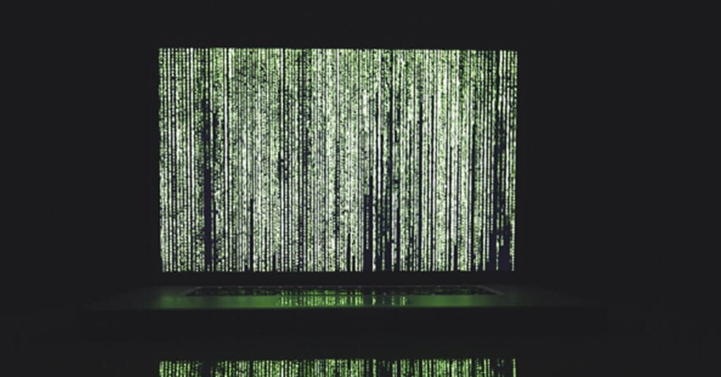 Binary code on a computer screen representing cybersecurity and data protection at Perimeter.