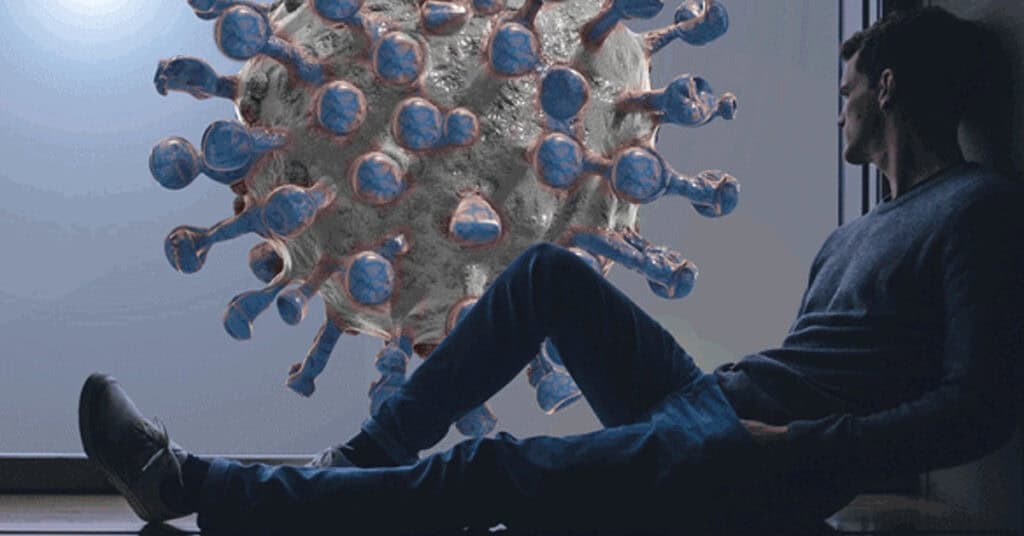 Virus protection threat detection concept with person observing COVID-19 virus model on screen at home or office.