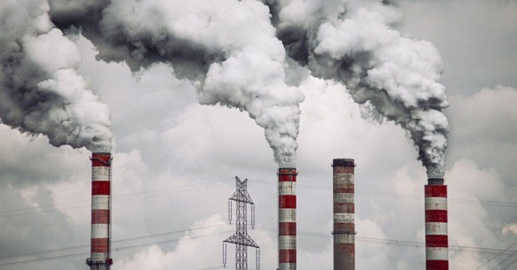 Industrial pollution, sky filled with thick smoke from factory chimneys, environmental impact, air pollution, climate change, factory emissions, carbon footprint, environmental awareness, pollution control, sustainability.