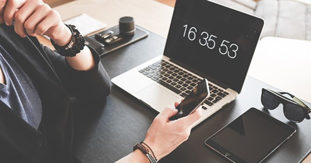 Security monitoring with laptop, smartphone, and tech gadgets for cybersecurity solutions.